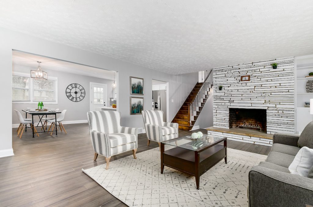 A living room that opens up to a dining area.