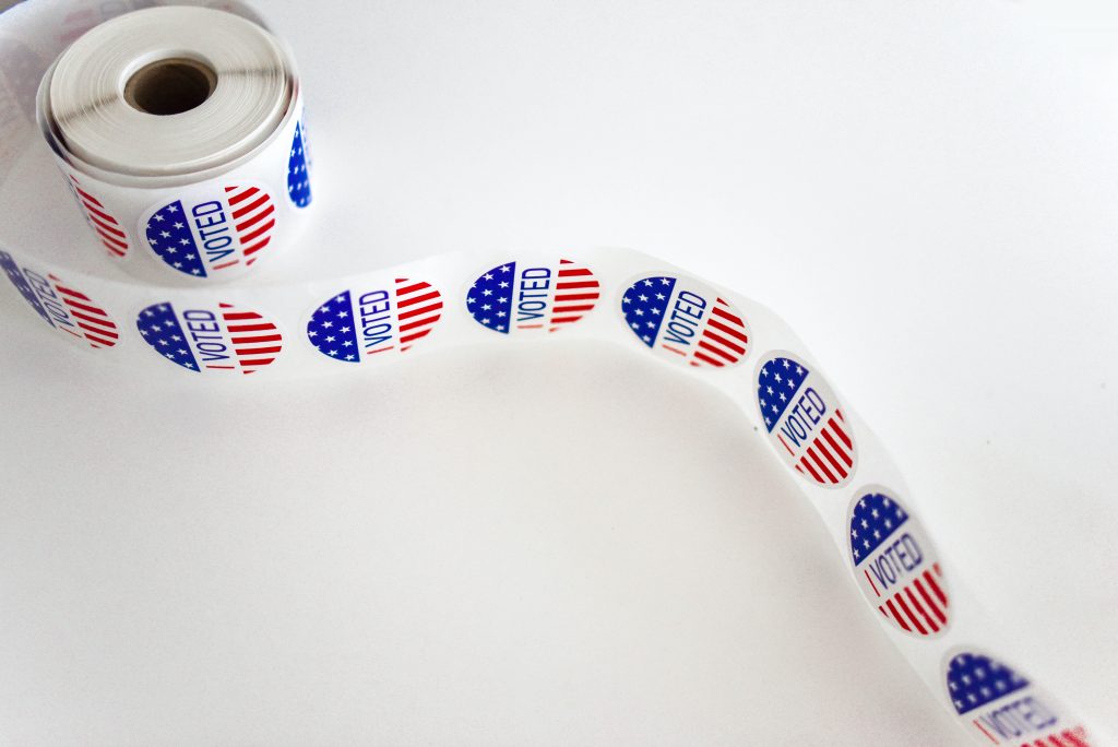 "I Voted" sticker roll on a white background during an election year.