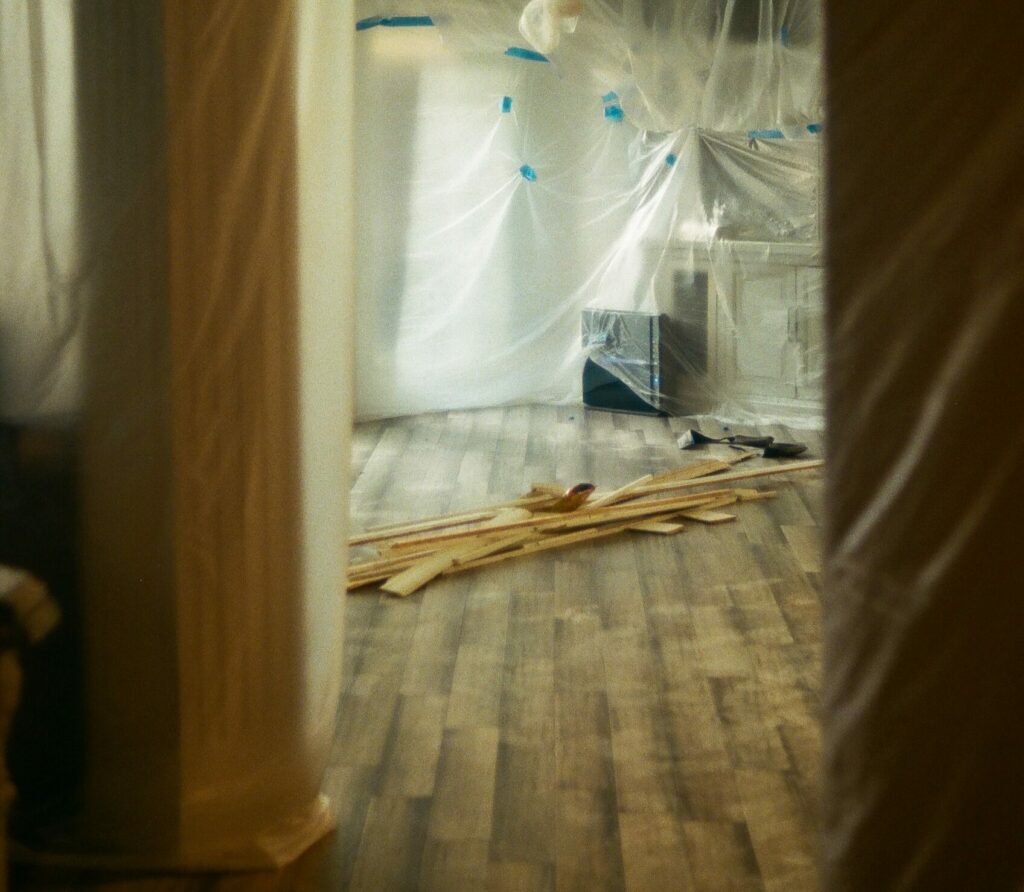 Plastic sheeting on the walls inside a home during a renovation project.