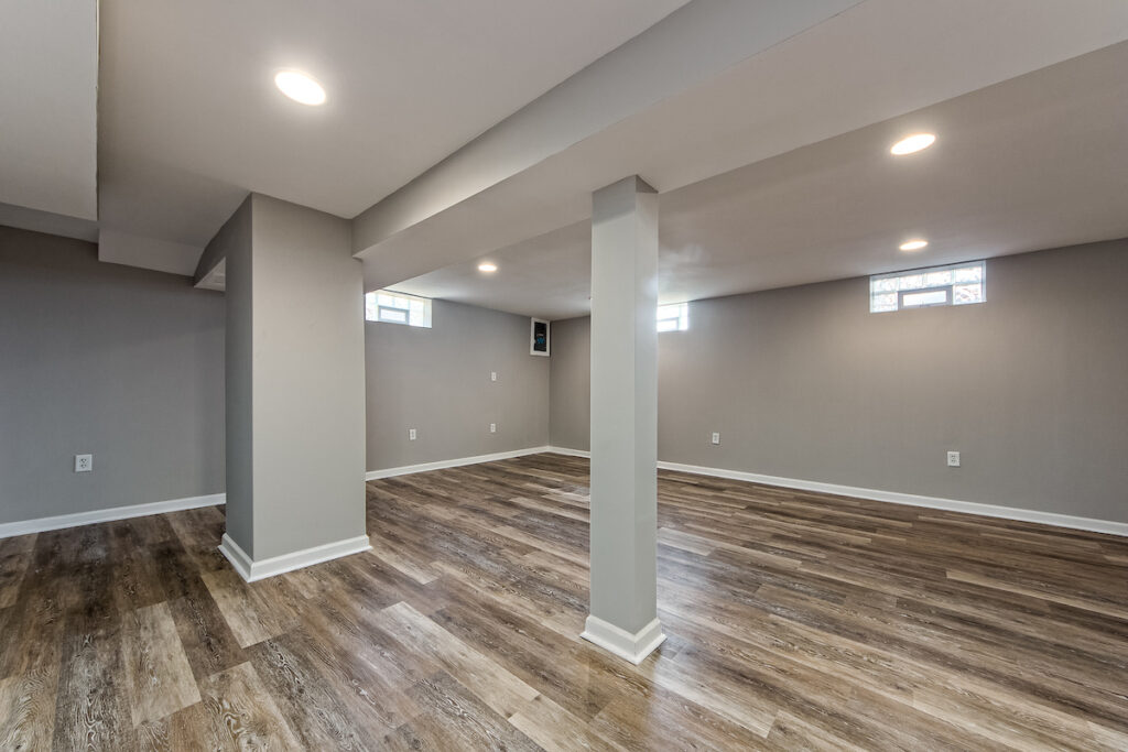 A modern basement remodeling job with plenty of natural light.