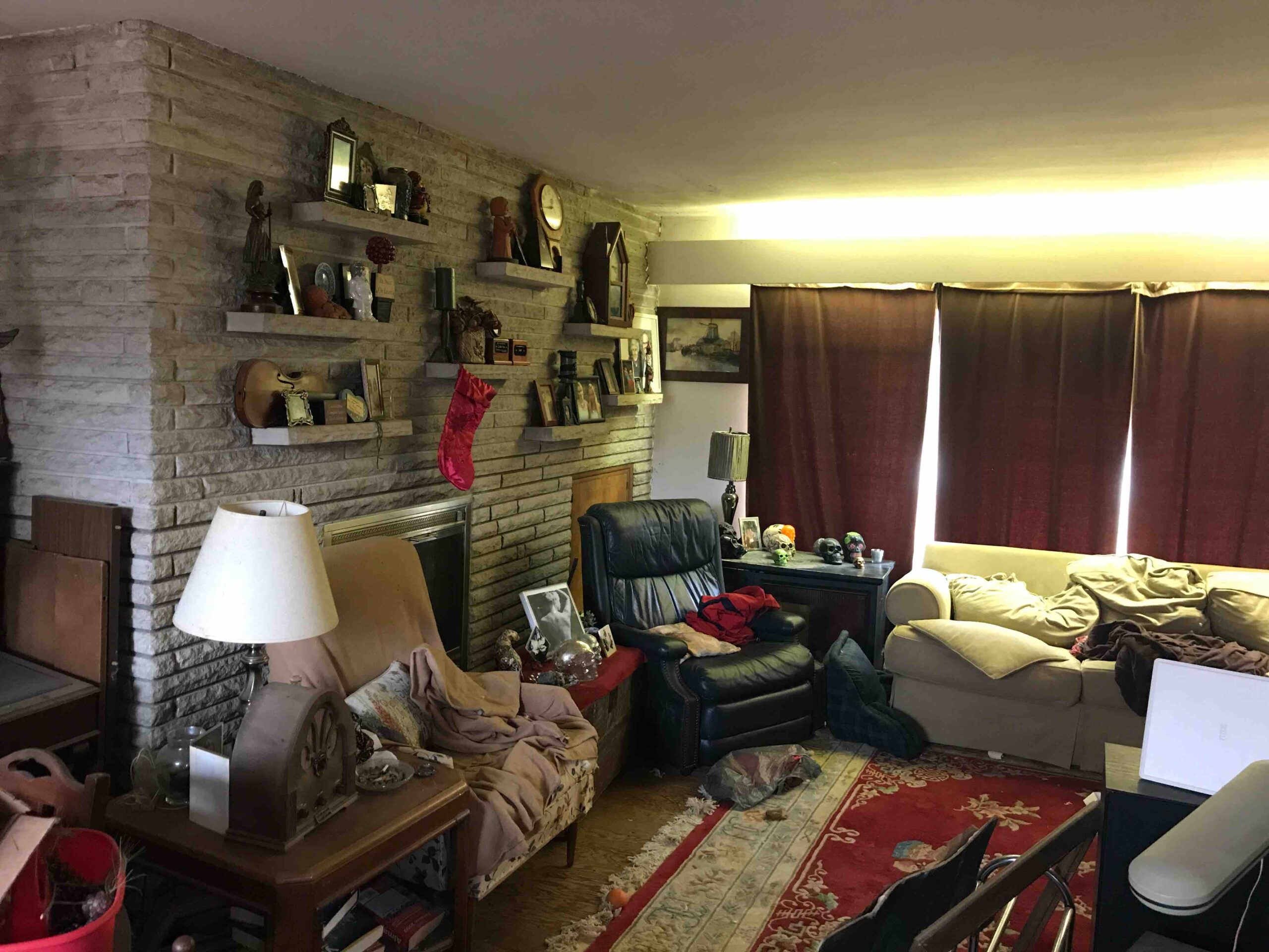 A trashed living room prior to renovation.