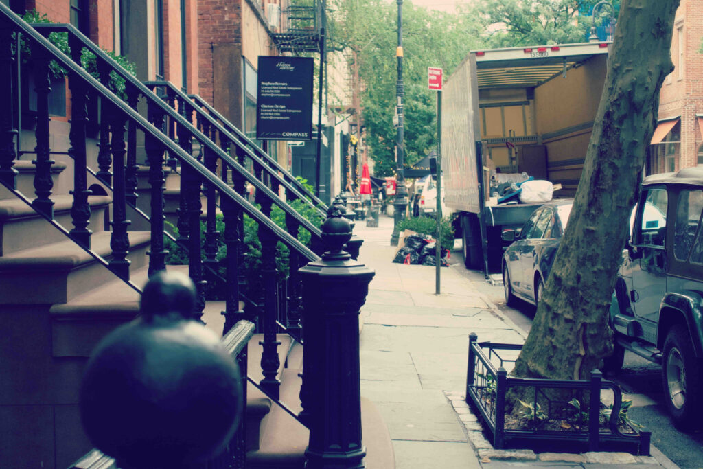 A moving truck on a busy city street.