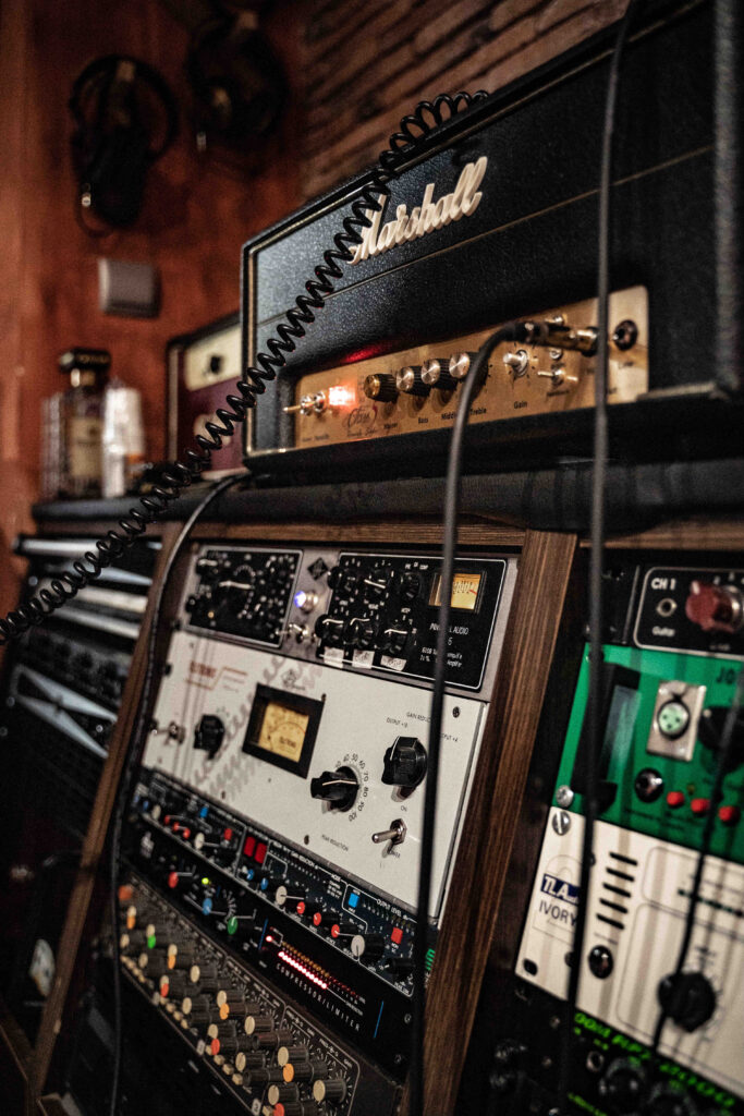 Stacks of guitar amplifiers and sound equipment.