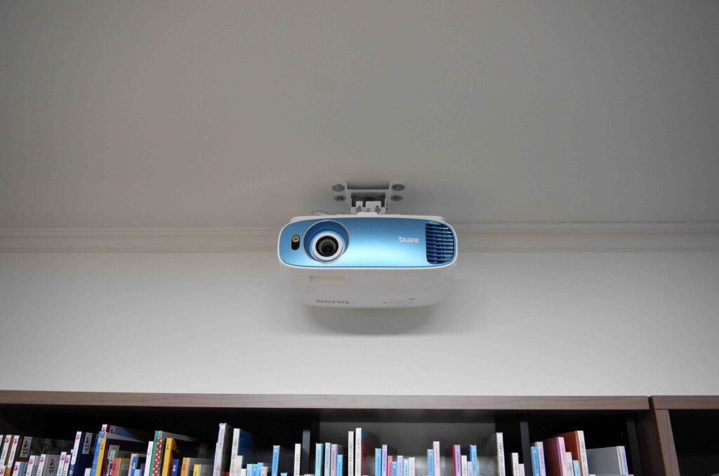 A film projector mounted on the ceiling.